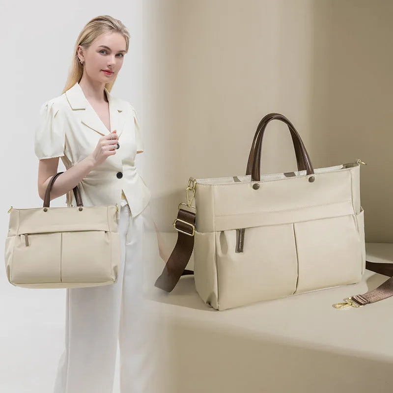 Women's oxford cloth portable briefcase in nuts and apricots colour with contrast stitching.