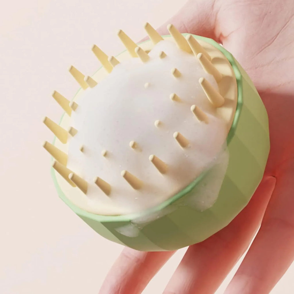Pet bath massage brush with drainage holes for cat and dog grooming during washing sessions