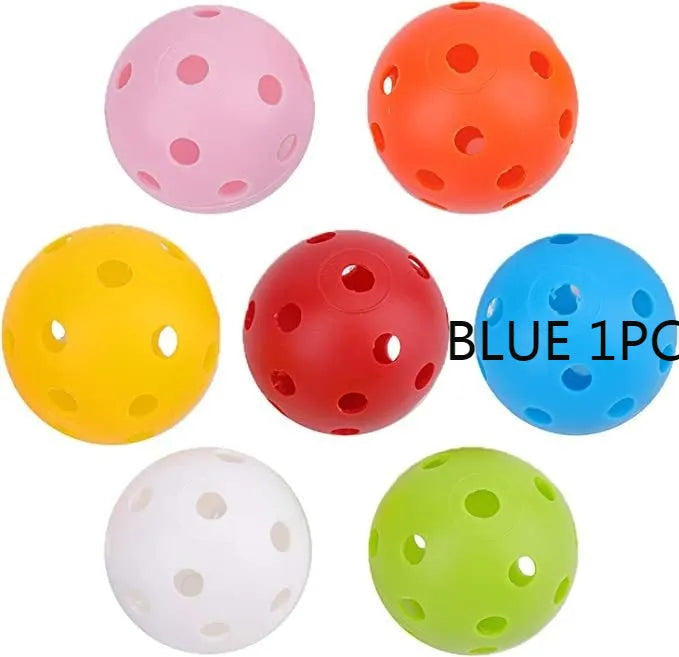 Assorted multi-colour 42mm golf practice balls with a net bag, shown next to practice putting holes.
