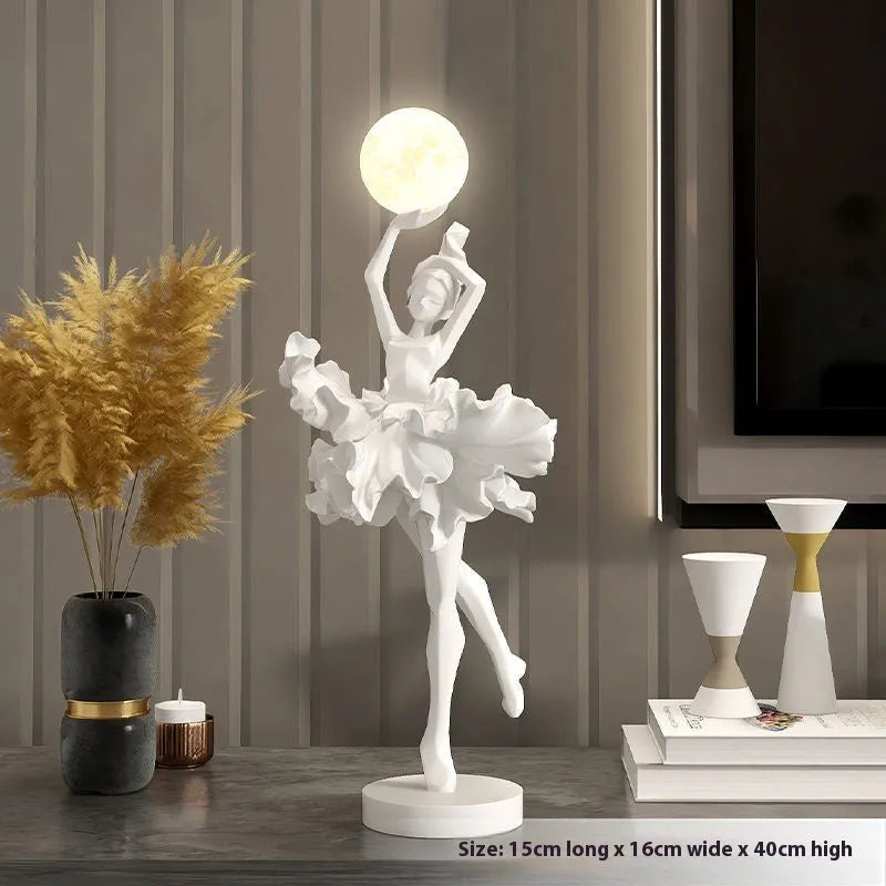 Small modern resin night lamp in black gold colour with USB charging cable.