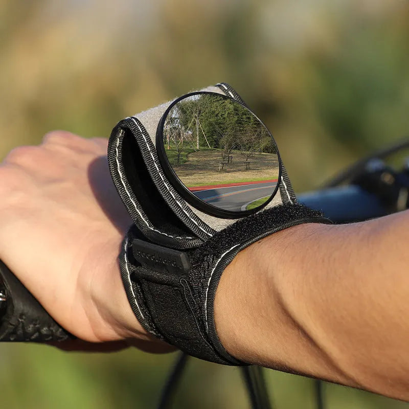 Black wrist-mounted rear-view mirror for bicycles with adjustable nylon strap