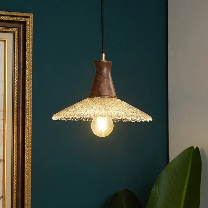 Wood and brass electroplated ceiling chandelier with a glass lampshade.
