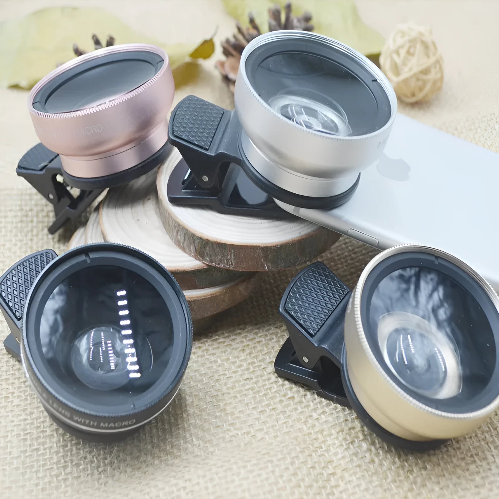 Mobile phone lens kit with wide angle, macro and fish eye lenses mounted on smartphone