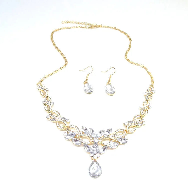 Gold alloy clavicle chain necklace with bow pendant on display