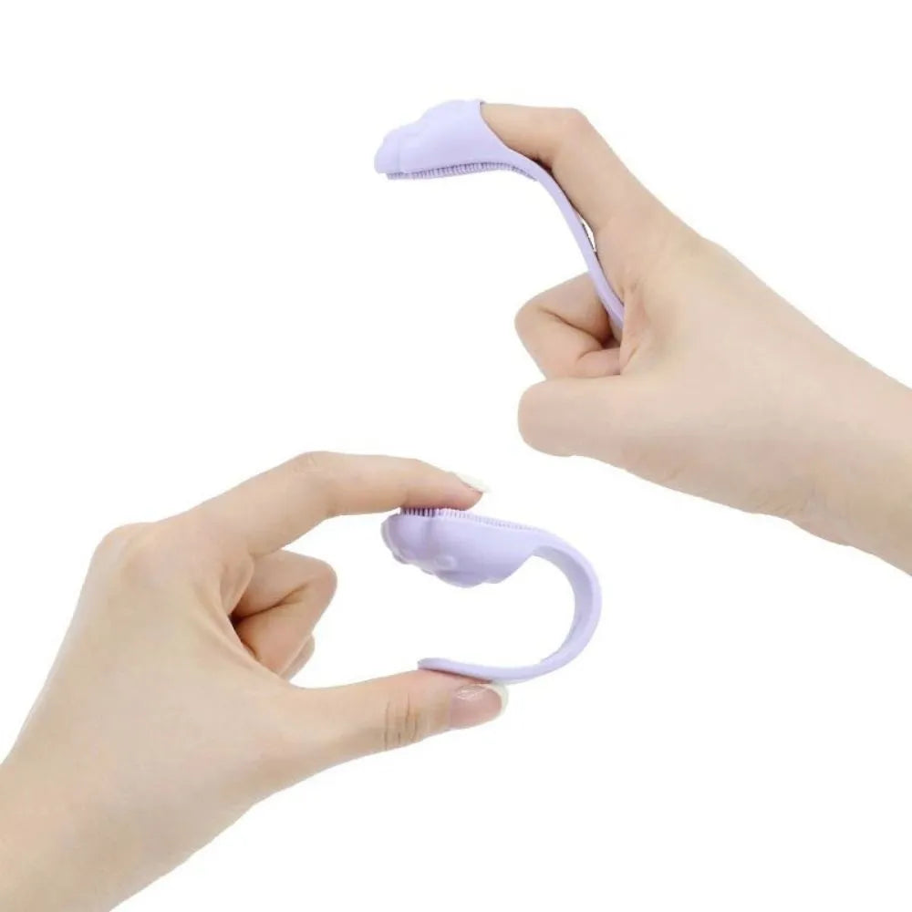 Pink silicone finger cover toothbrush for pets on a white background