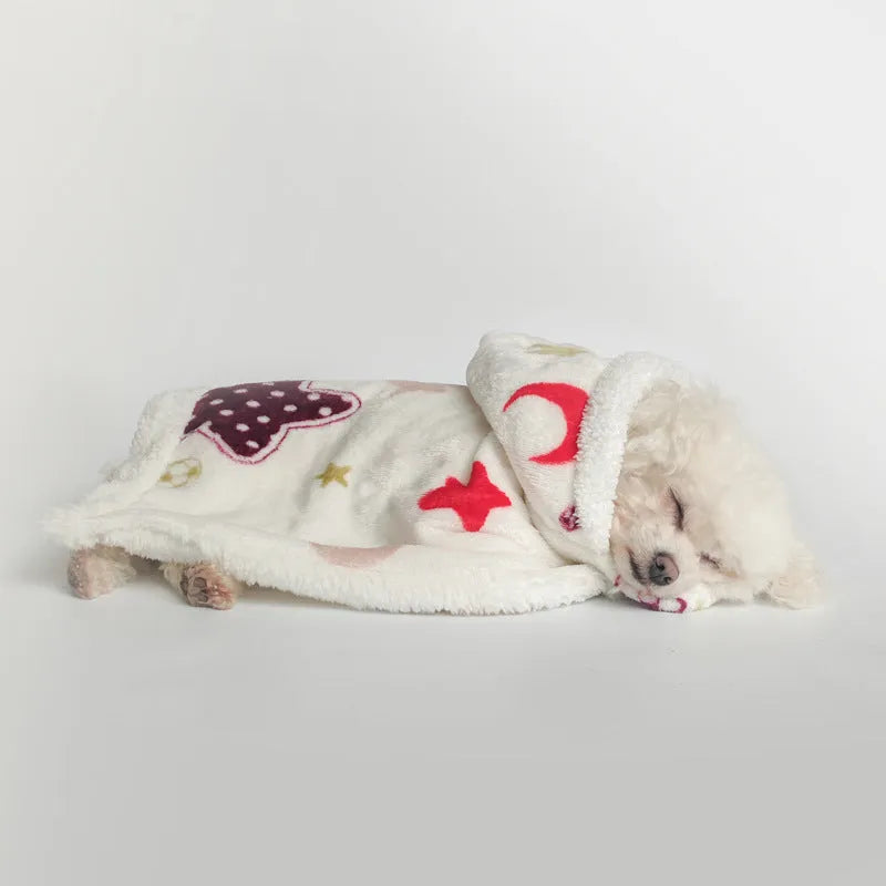 White coral fleece pet pajamas with moon and stars pattern on a light background, size M