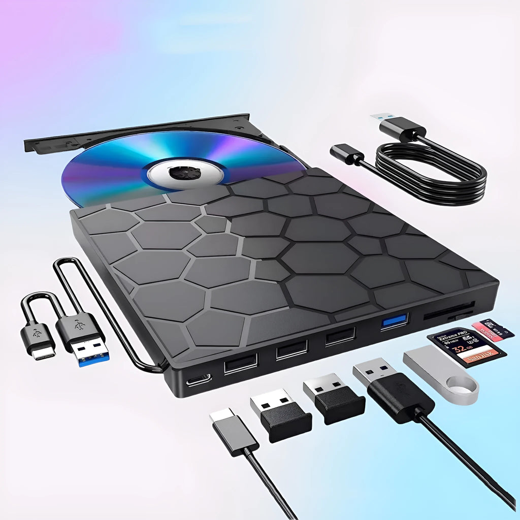 Black portable external USB CD/DVD drive and writer on a desk next to a laptop