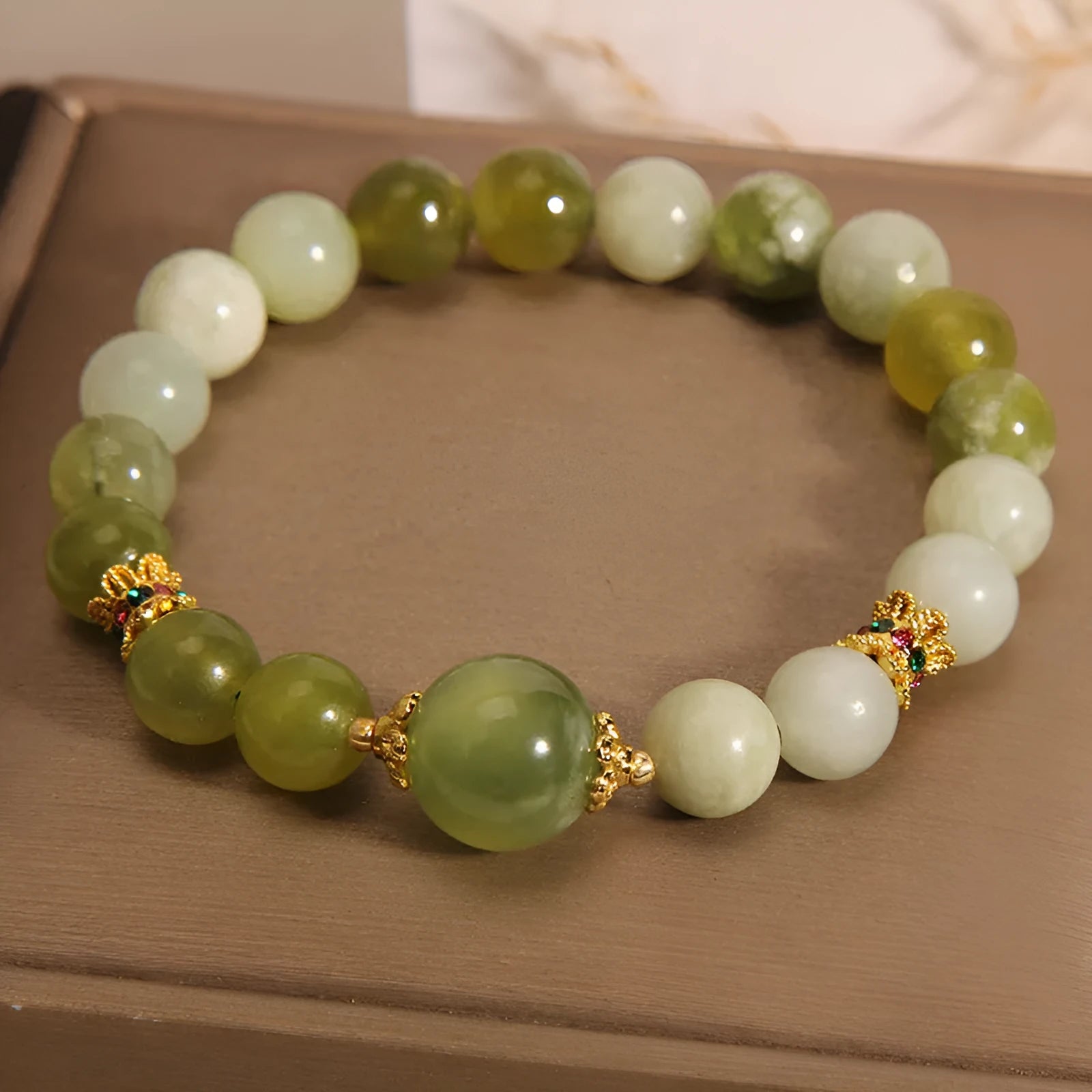 Xiuyan jade women's bracelet in jade green colour with original design.