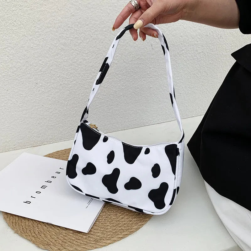 Women's small nylon underarm bag with leopard print pattern and zipper closure, 23cm size