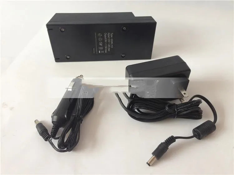 GKL112 compact white 220V car charger unit with UK plug, shown on a car dashboard.