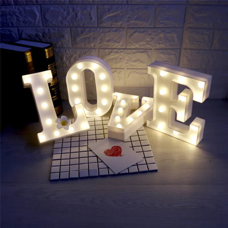 White plastic LED marquee letter sign with warm white glow, 22cm tall