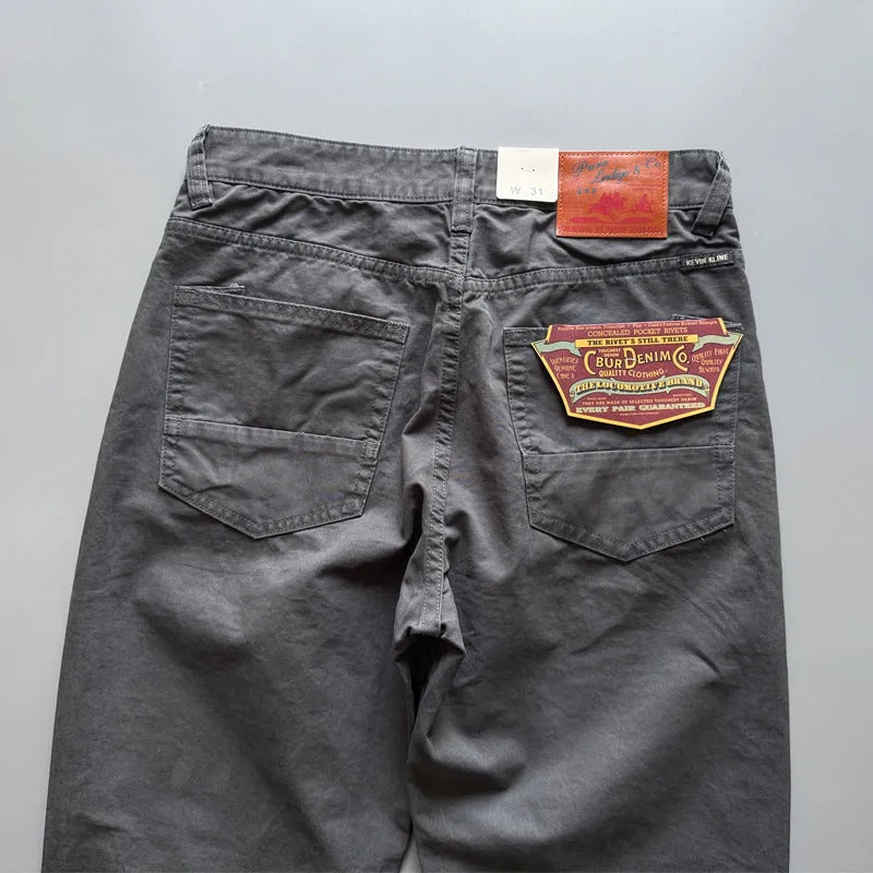 Men's grey straight-leg casual cotton trousers on a hanger.