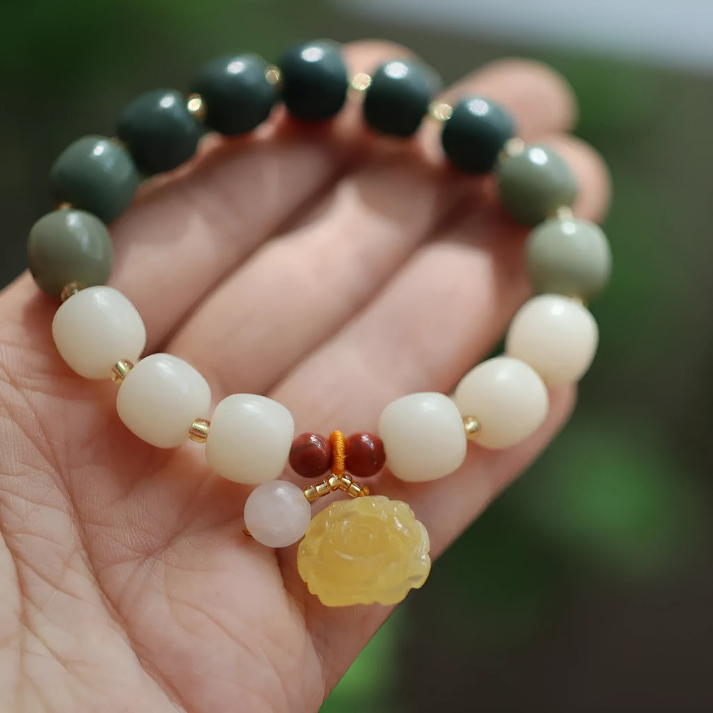 White jade gradient bodhi root bracelet with 10mm floral beads and beeswax lotus decorations