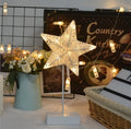 Rattan and copper wire LED table lamp in star, heart, or moon shape for bedroom decoration.