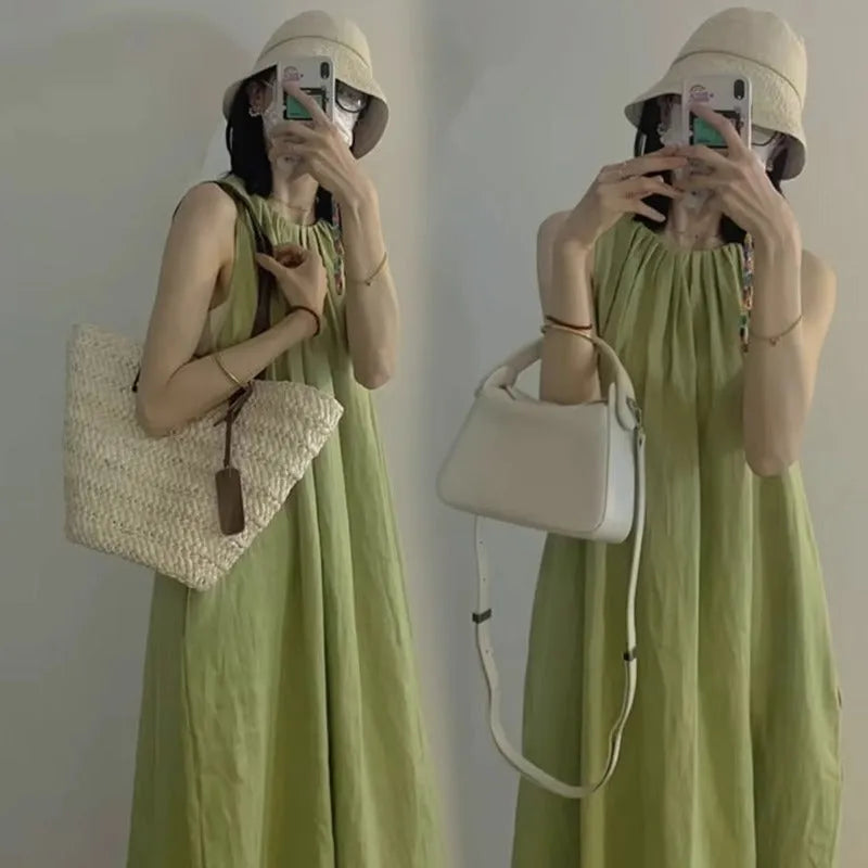 Plus size women's sleeveless asymmetric cotton vest skirt in green with black pants option on model