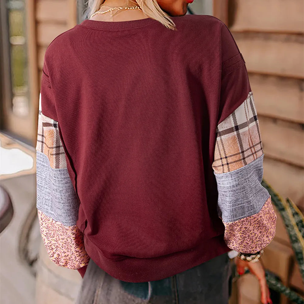 Beige and red women's loose-fit plaid long-sleeved polyester top on a hanger.