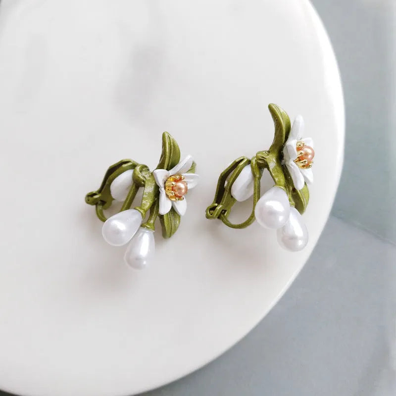 Alloy flower ear stud and clip set with sterling silver needle camellia design and contrasting colour floral motif