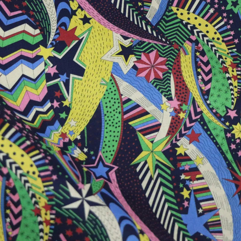 Blue plant and flower pattern on 100% cotton fabric, showing the 145 cm width.