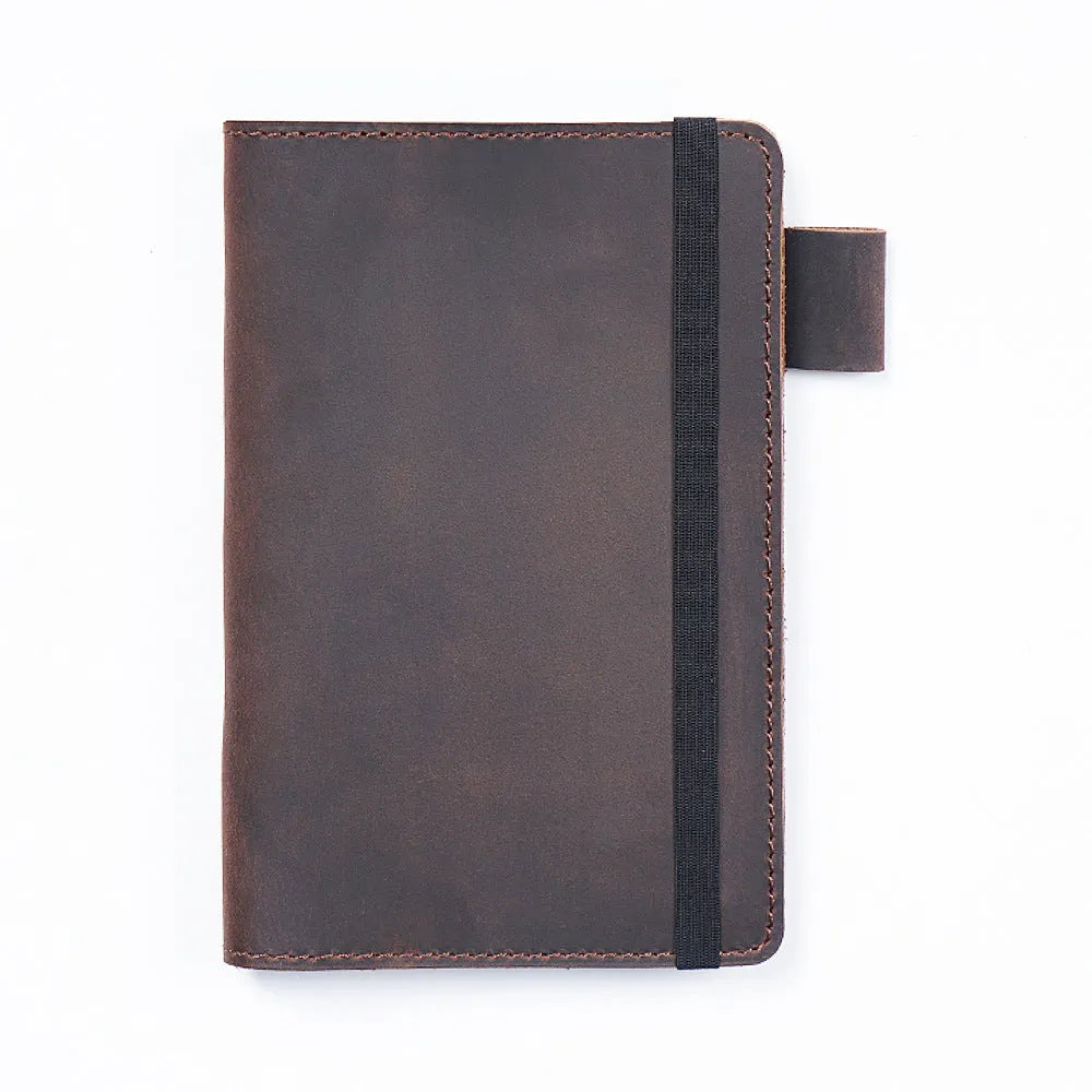 Handmade kraft notebook with cowhide cover showing dark green colour and 9x14cm wood-free paper pages