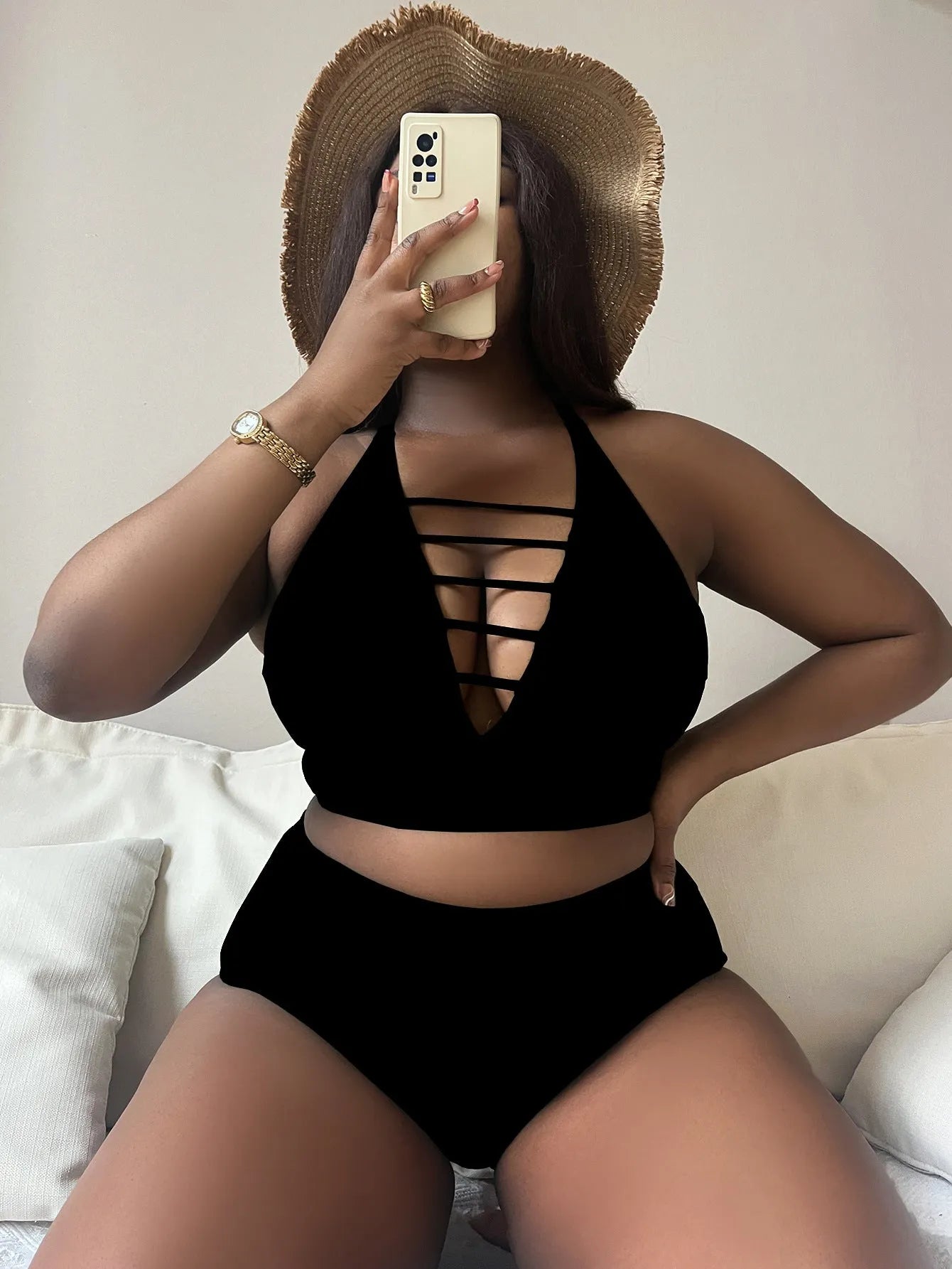 Plus size black halter bikini with cross back straps and high waist briefs on mannequin