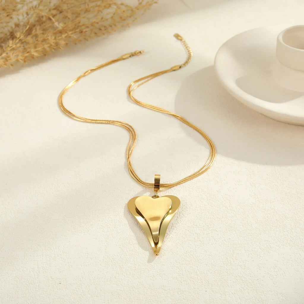 Women's stainless steel snake bones chain necklace with geometric double heart pendant