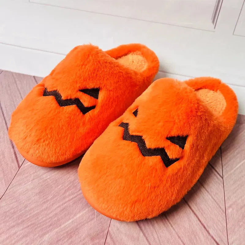 Orange pumpkin-shaped plush slippers with coral velvet upper on a non-slip PVC sole