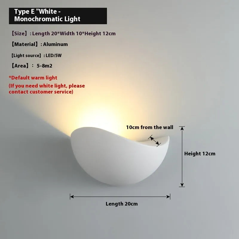 Black bird's nest style aluminium alloy LED lamp with warm white glow.