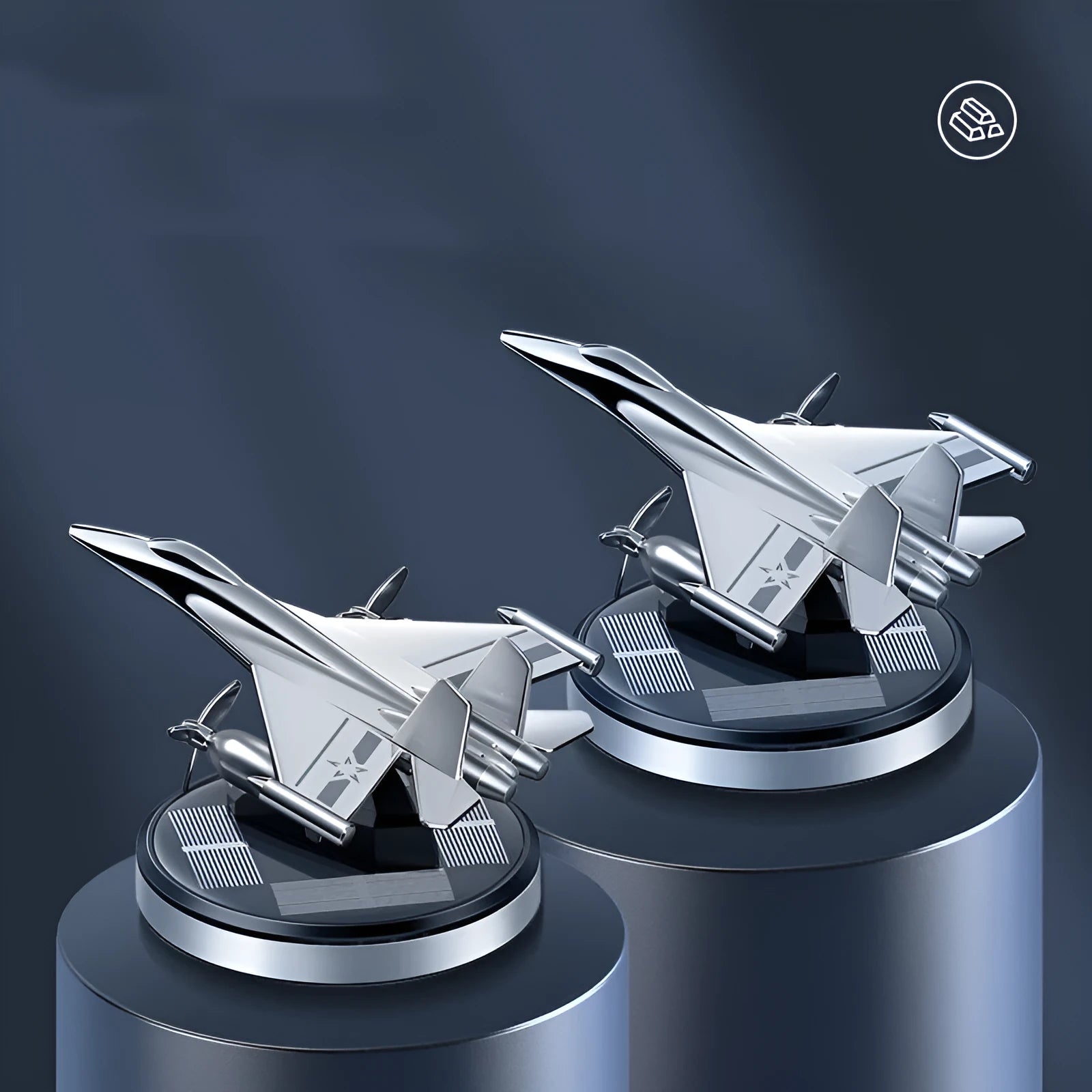 Solar powered rotating silver fighter jet car air freshener ornament on a dashboard.