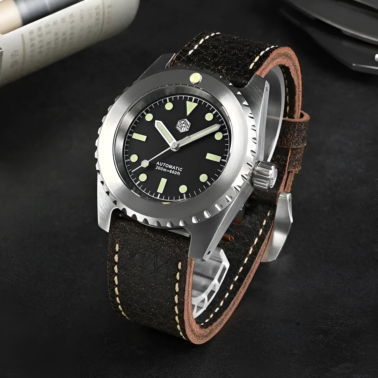 Men's 316L stainless steel diving automatic mechanical watch with black dial, luminous markers, and cowhide strap on white background