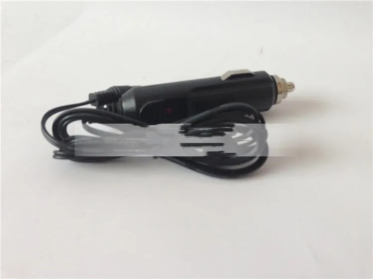 GKL112 compact white 220V car charger unit with UK plug, shown on a car dashboard.