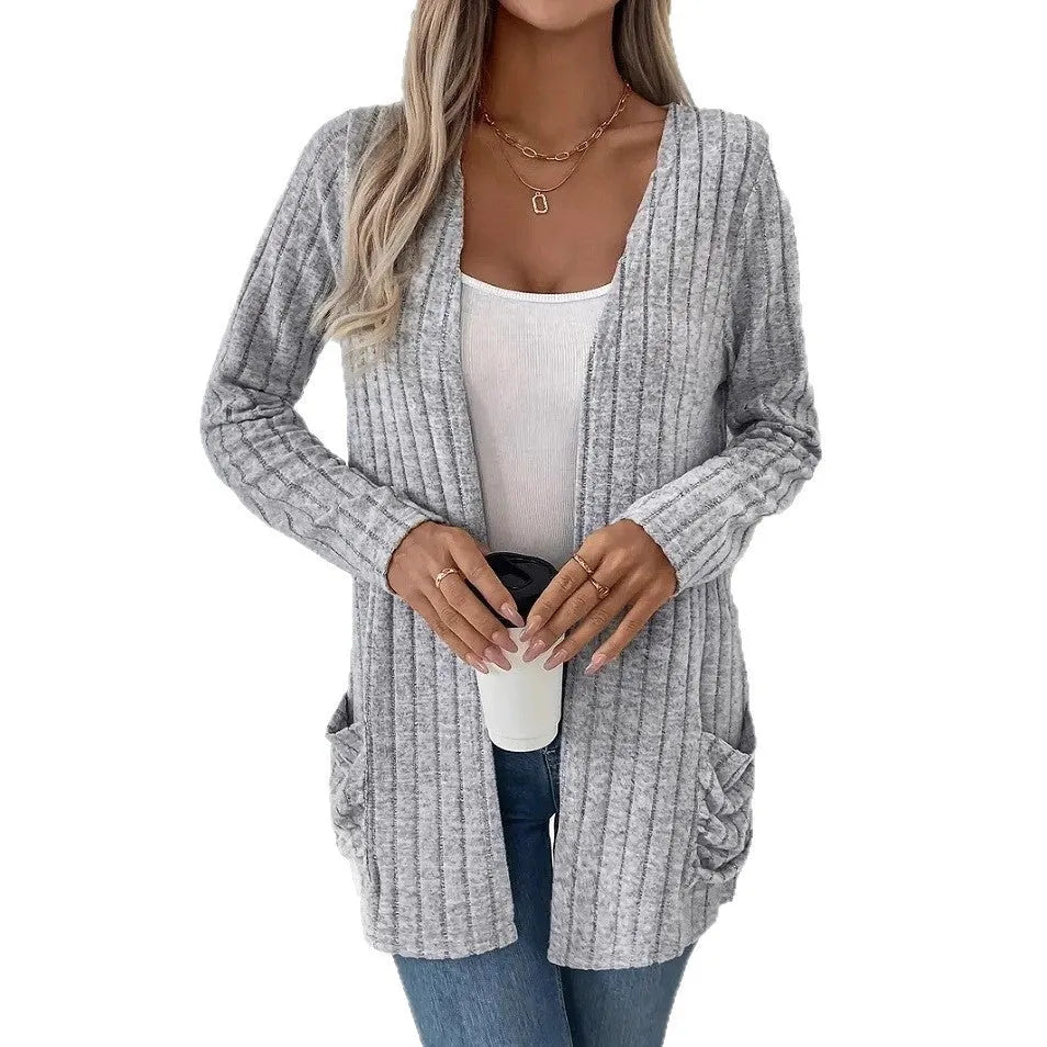 Solid colour long sleeve cardigan knitwear with front pockets in loose fit, available in black and granny grey