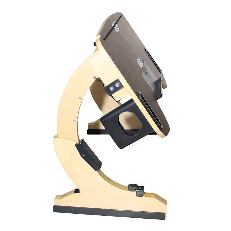 White maple wooden bed table holding a laptop at an angle, folded legs visible on a duvet.