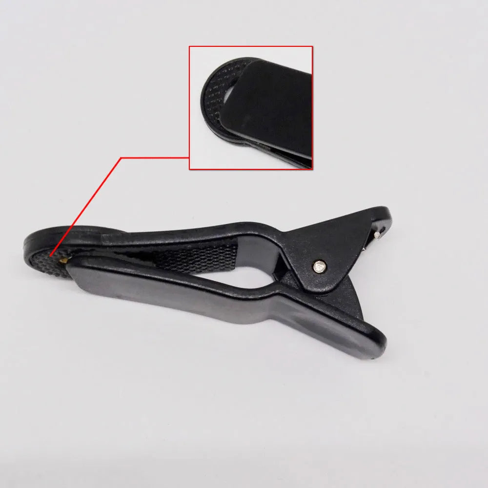 12x telescopic zoom lens with universal collar clip for smartphones on a mobile phone.