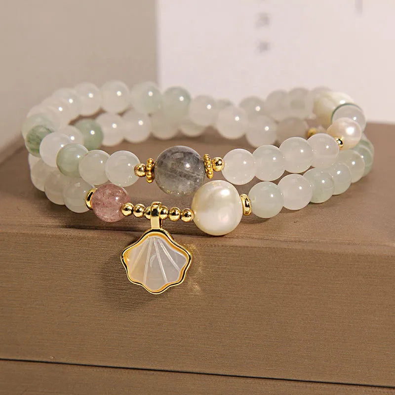 Women's crystal bracelet with artistic ginkgo leaf pendant and rhinestone accents