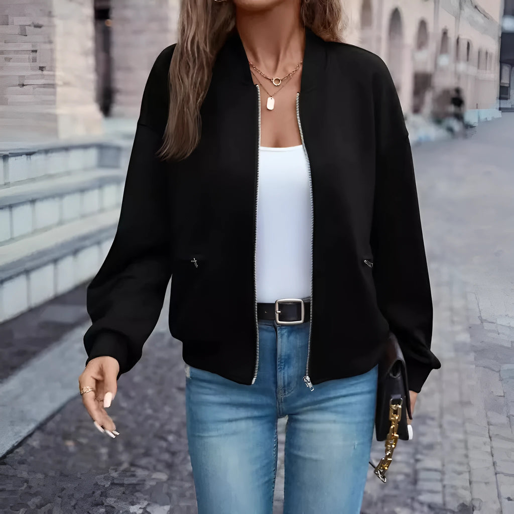 Black women's casual zip jacket with long sleeves and faux pocket detail.