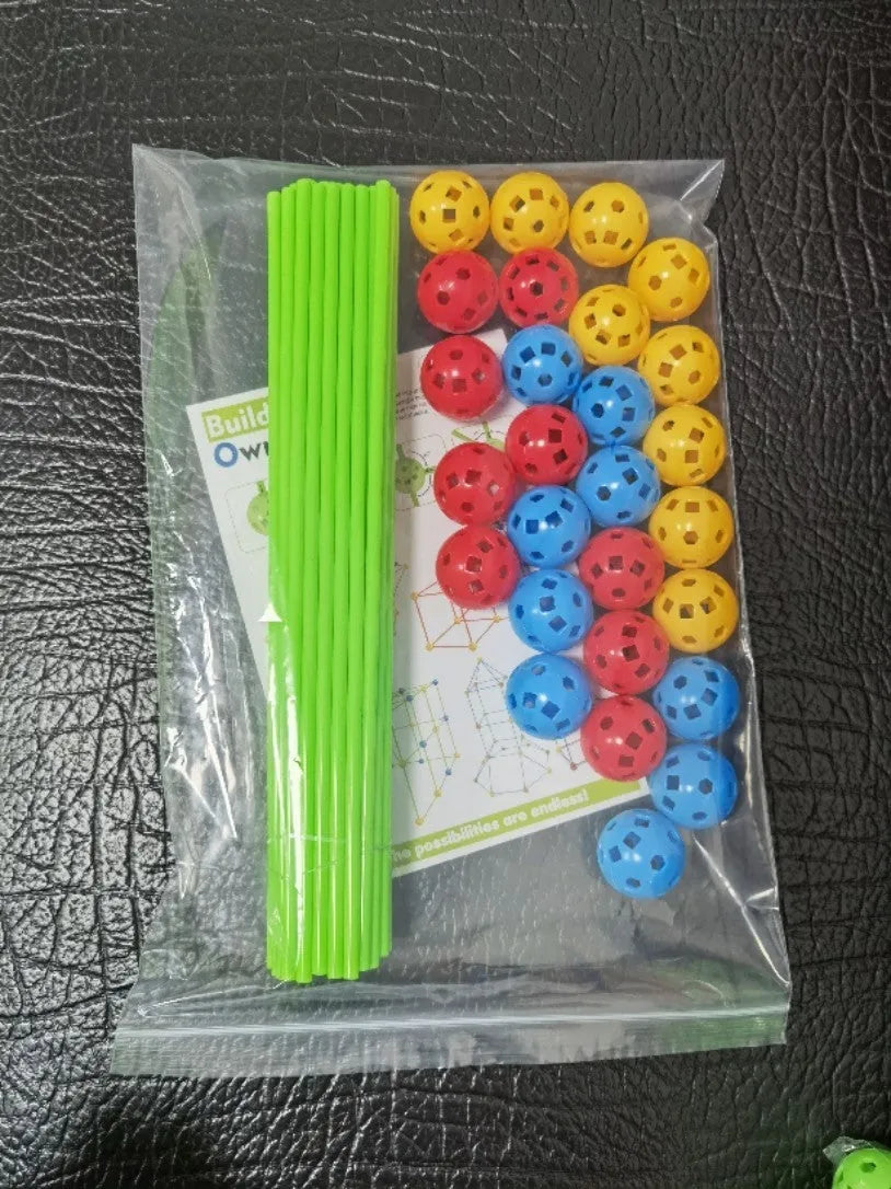 Luminous plastic fort building kit for kids with connecting sticks, balls, and storage bag.