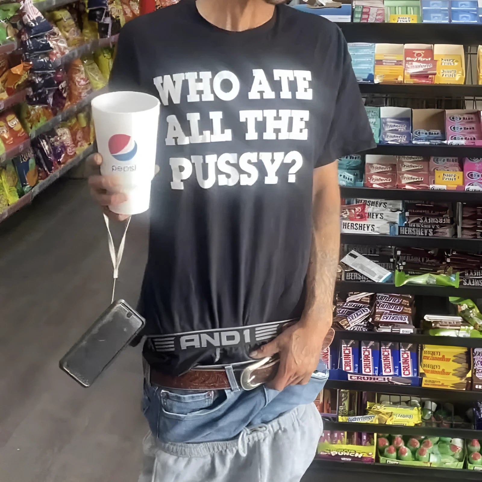 Man wearing a black loose-fit heavyweight cotton retro short-sleeved t-shirt.