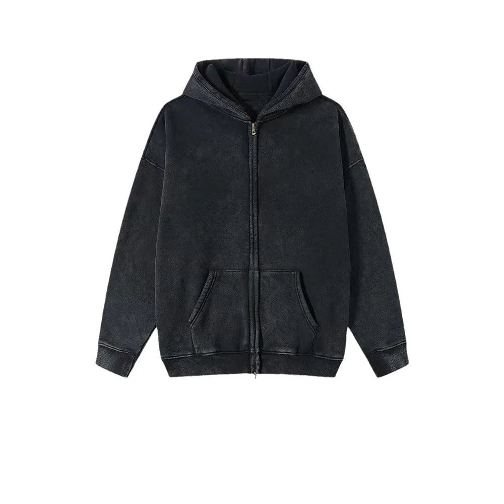 Man wearing a washed black cotton fleece-lined hooded cardigan with a double zipper front.