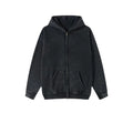 Man wearing a washed black cotton fleece-lined hooded cardigan with a double zipper front.