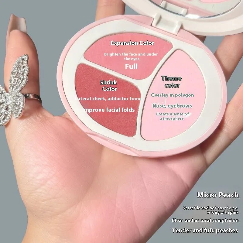 Tricolor blush palette showing three matte shades: peach, apricot, and mauve-pink