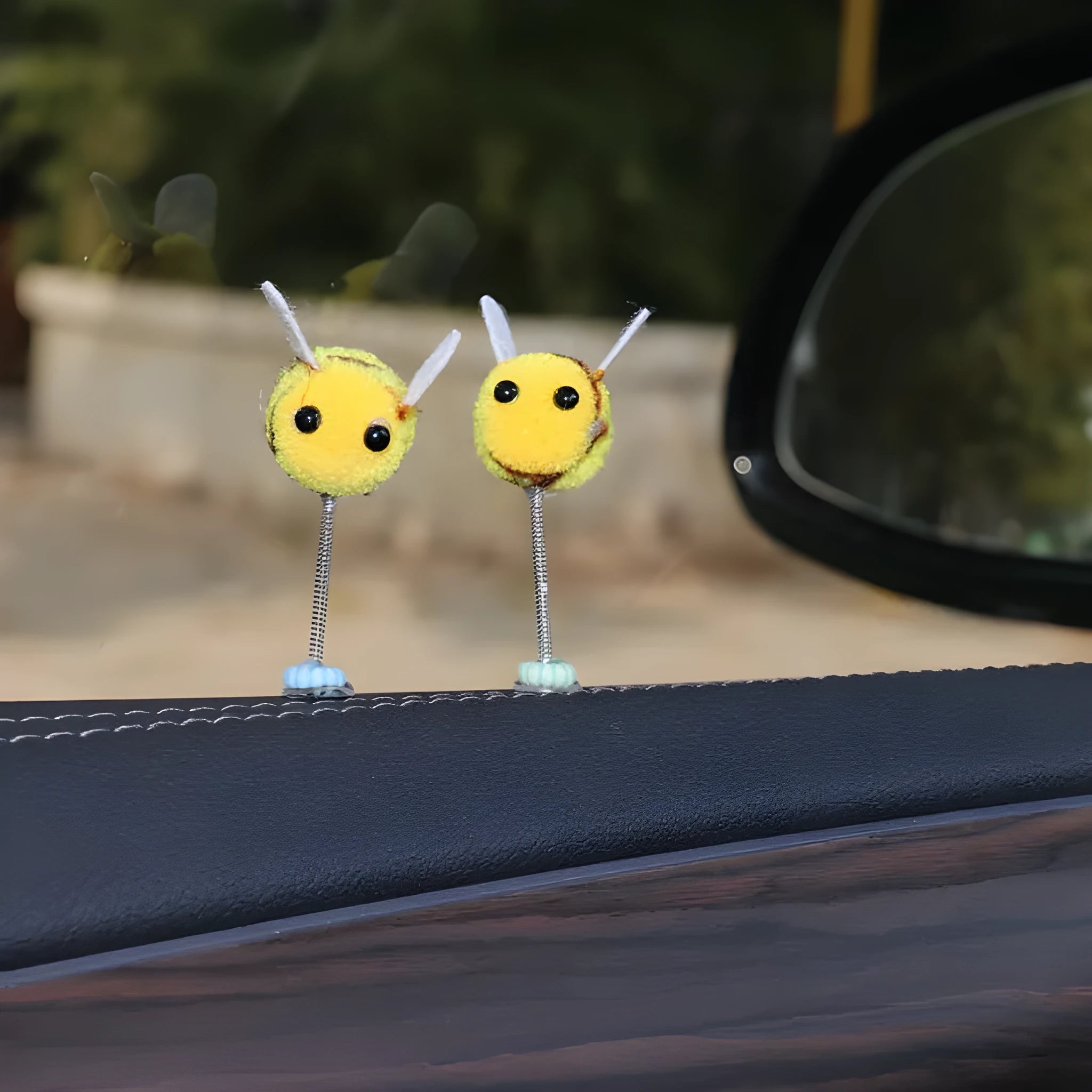 Soft fur ball Swing Spring Bee car decoration ornament measuring 3 by 3 centimetres.