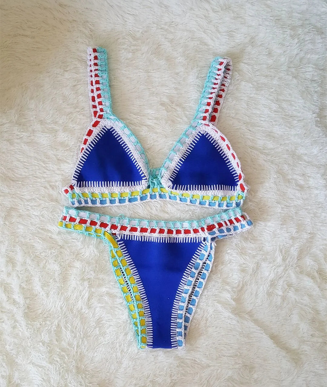 Hand crochet colourful bikini set with lace trim and rubber straps in multiple colours on white background
