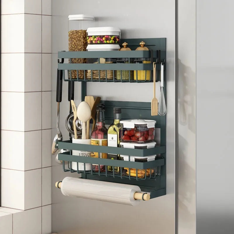 Black magnetic metal refrigerator side storage rack holding a tissue roll and a seasoning bottle