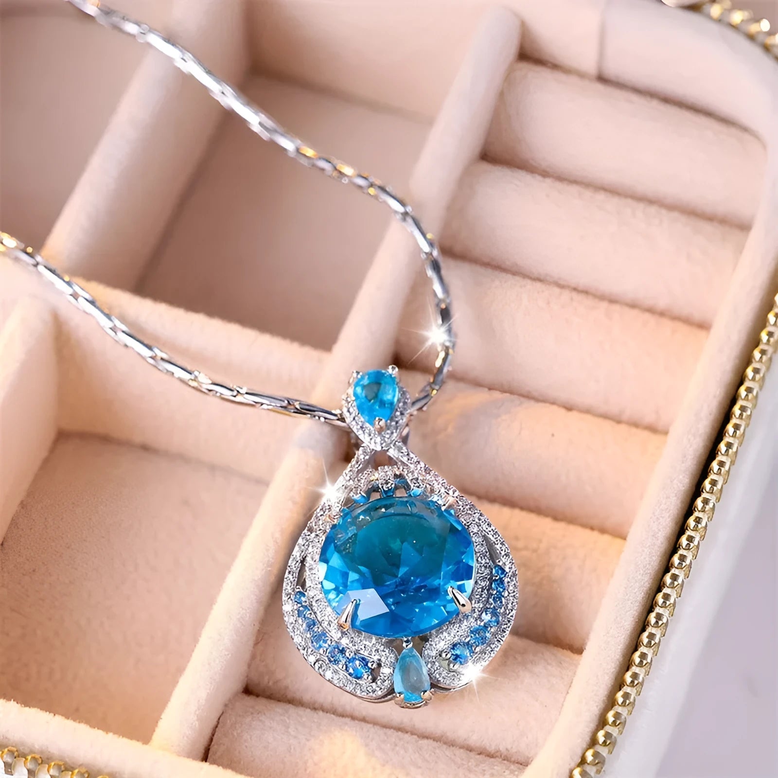 Women's blue crystal geometric necklace with fireworks-cut pendant on water wave chain