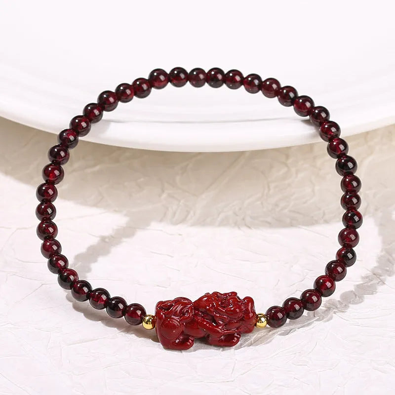 Women's garnet bracelet with purple sand pixiu carving and strawberry quartz square beads