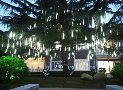 Outdoor waterproof LED meteor shower lights in garden installation showing realistic falling star lighting effects