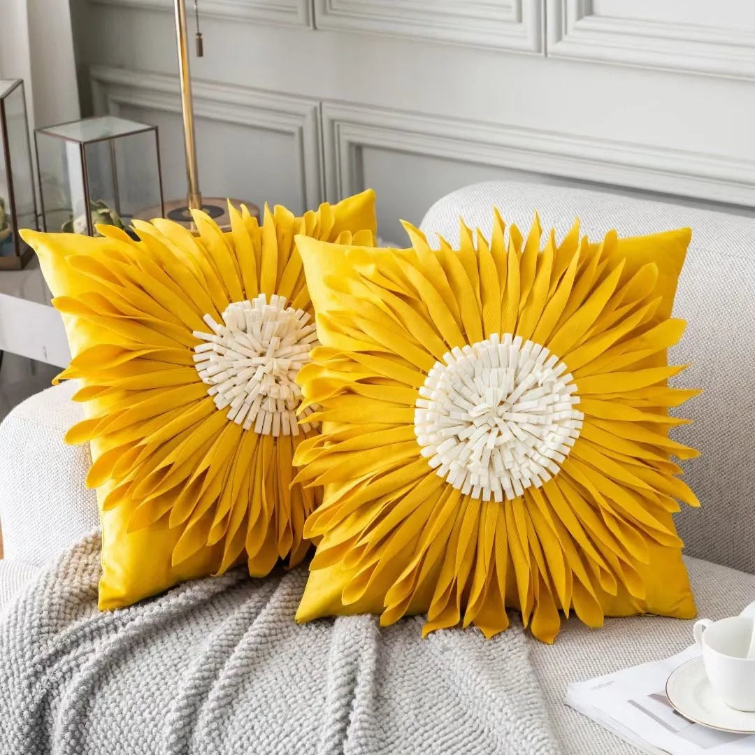 White polyester velvet cushion cover with blue chrysanthemum tufting pattern and fringed hem on a sofa