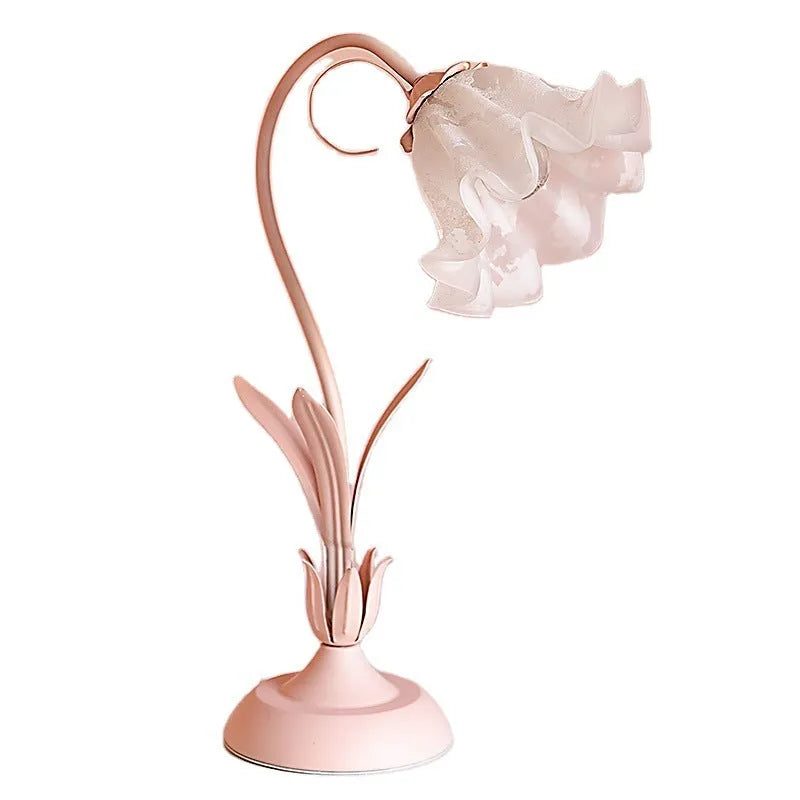 Pink princess room desk lamp with ceramic flowers, glass lampshade, and dimmer switch on a wooden desk