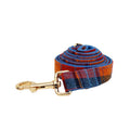 Blue velvet plaid dog collar with integrated hand-holding rope and leash set on cloth material