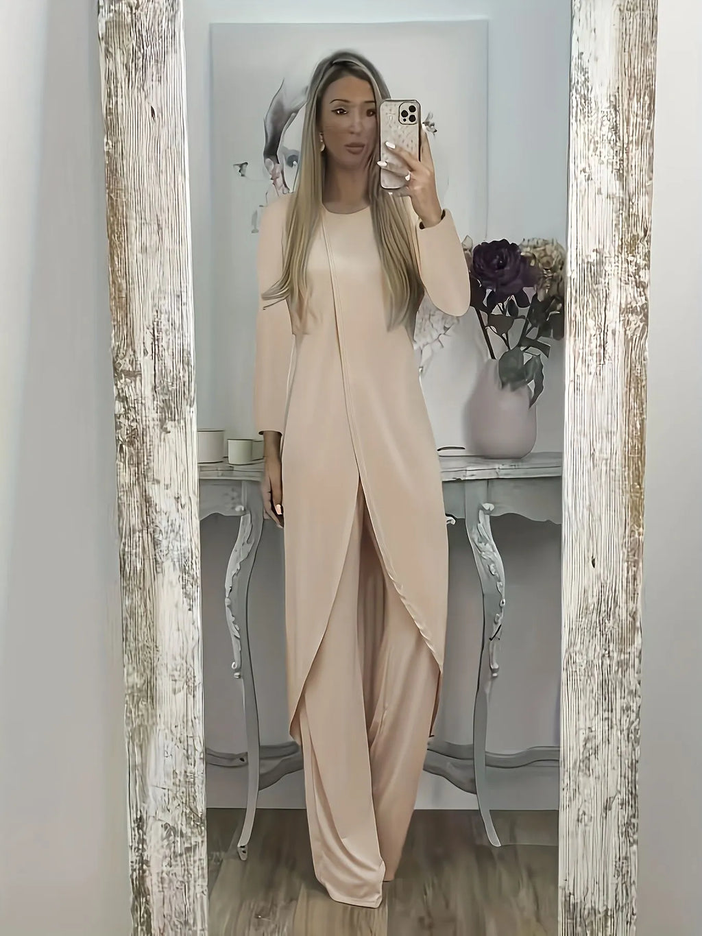 Casual long sleeve two-piece loungewear set in a neutral colour, showing the loose round neck top and matching trousers.